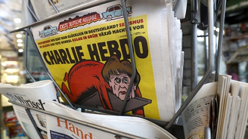 Charlie Hebdo поместил на обложку Меркель с отрубленной головой Шульца